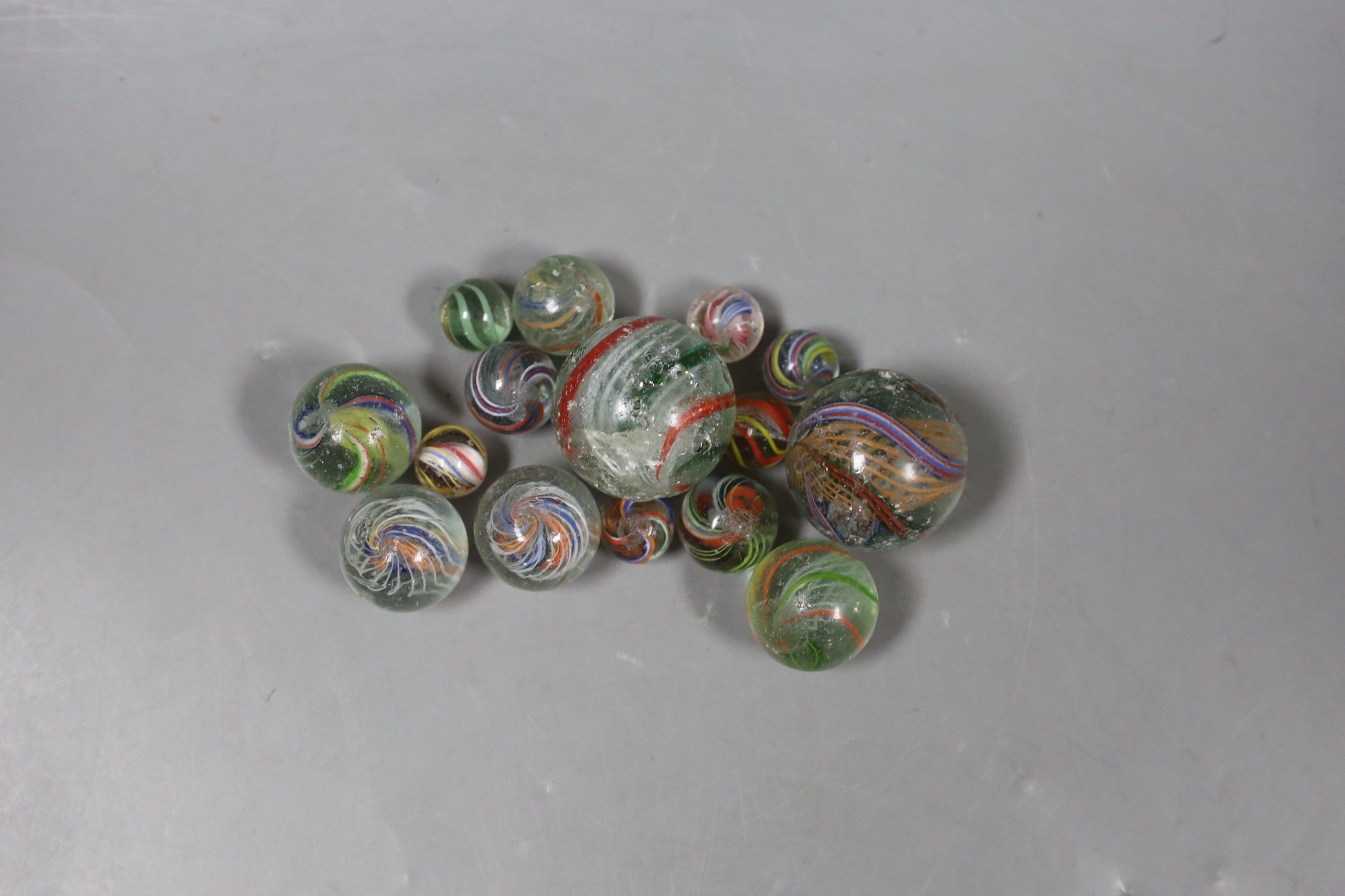 A group of latticino glass marbles